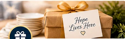 Gift box wrapped with a gold ribbon and a message of hope